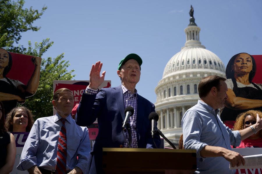 Sen. Chris Murphy at the podium during the Senate launch of the Living Wage For All Act