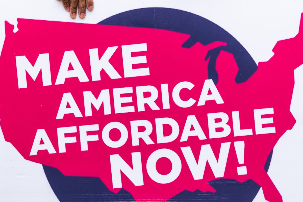 A Make America Affordable Now sign at the federal Living Wage For All Act introduction